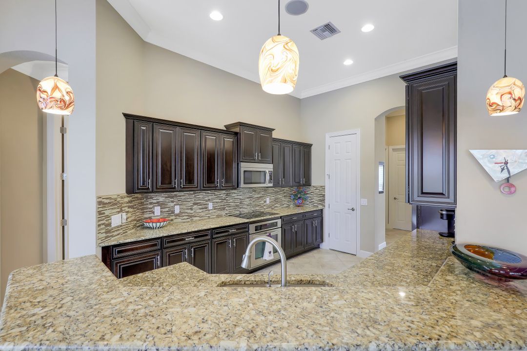 9403 Copper Rock Ct, Naples, FL 34120