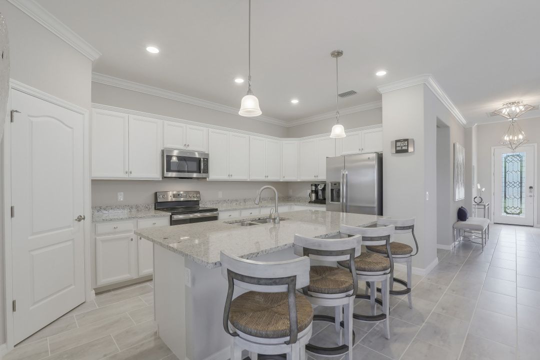 1493 Artesia Dr W, Naples, FL 34113