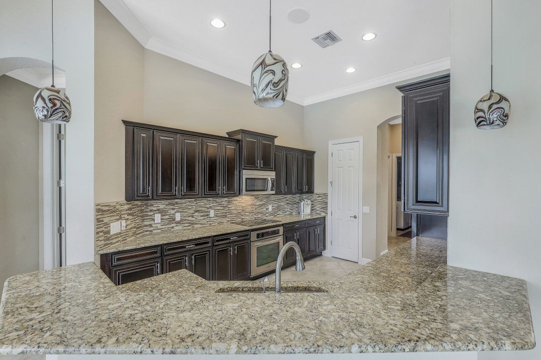 9403 Copper Rock Ct, Naples, FL 34120