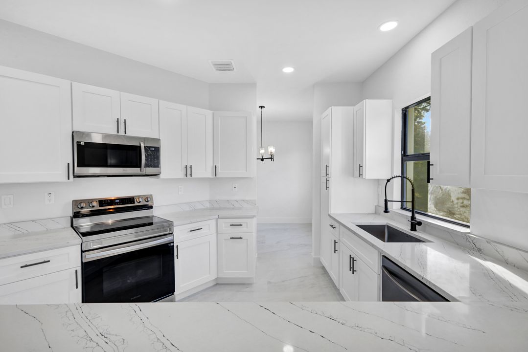 1222 Hilliard St E, Lehigh Acres, FL 33974