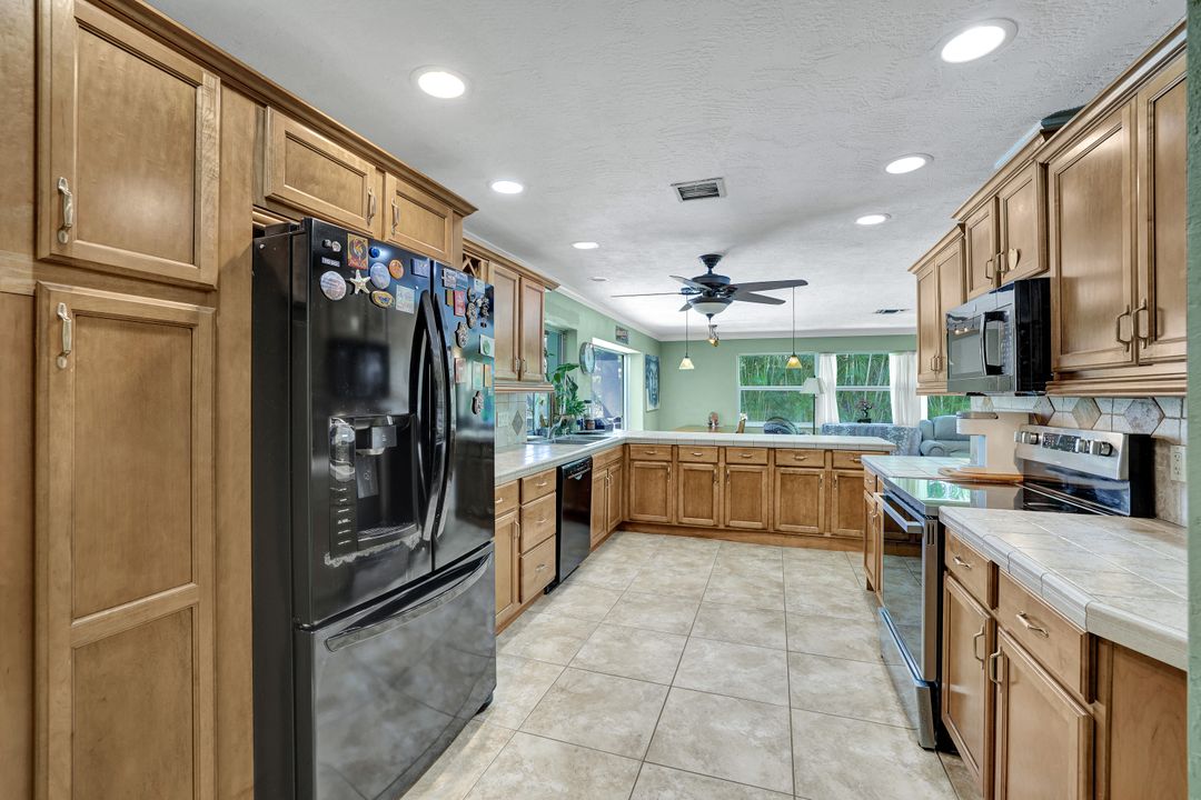 208 Baltusrol Dr, Naples, FL 34113