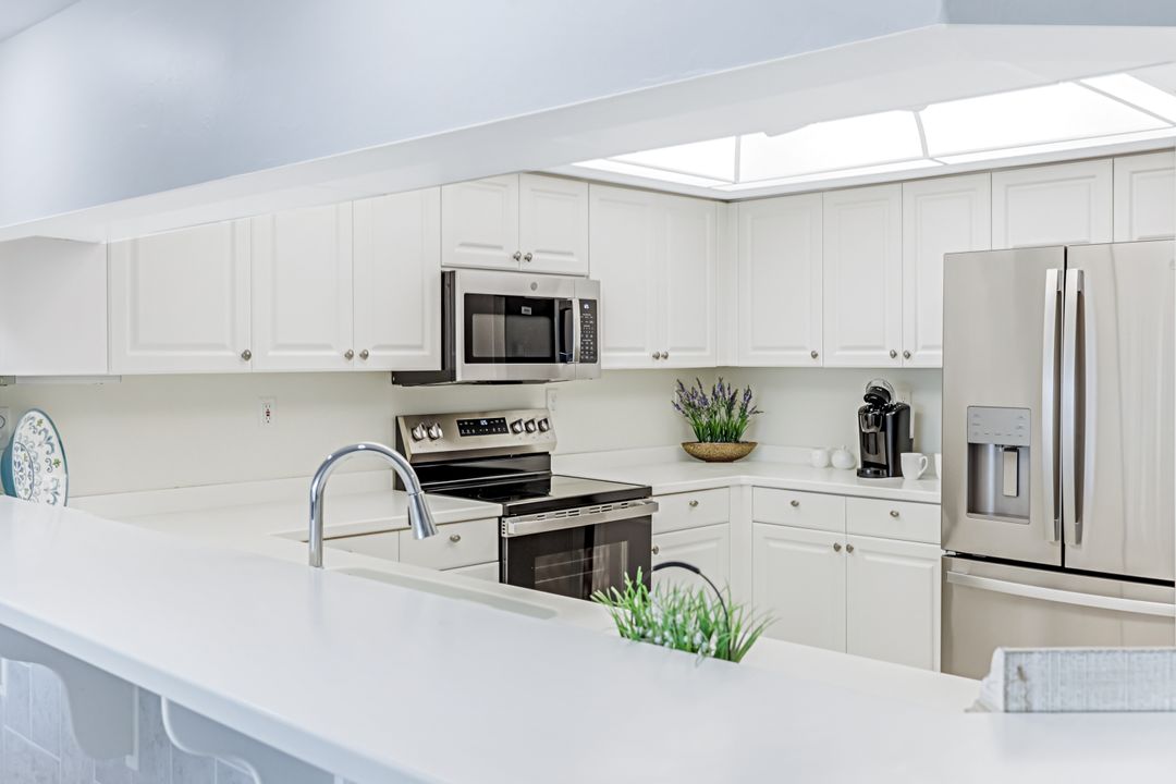 21 Bluebill Ave, Naples, FL 34108