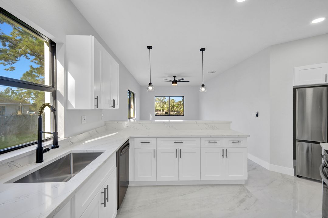 1222 Hilliard St E, Lehigh Acres, FL 33974