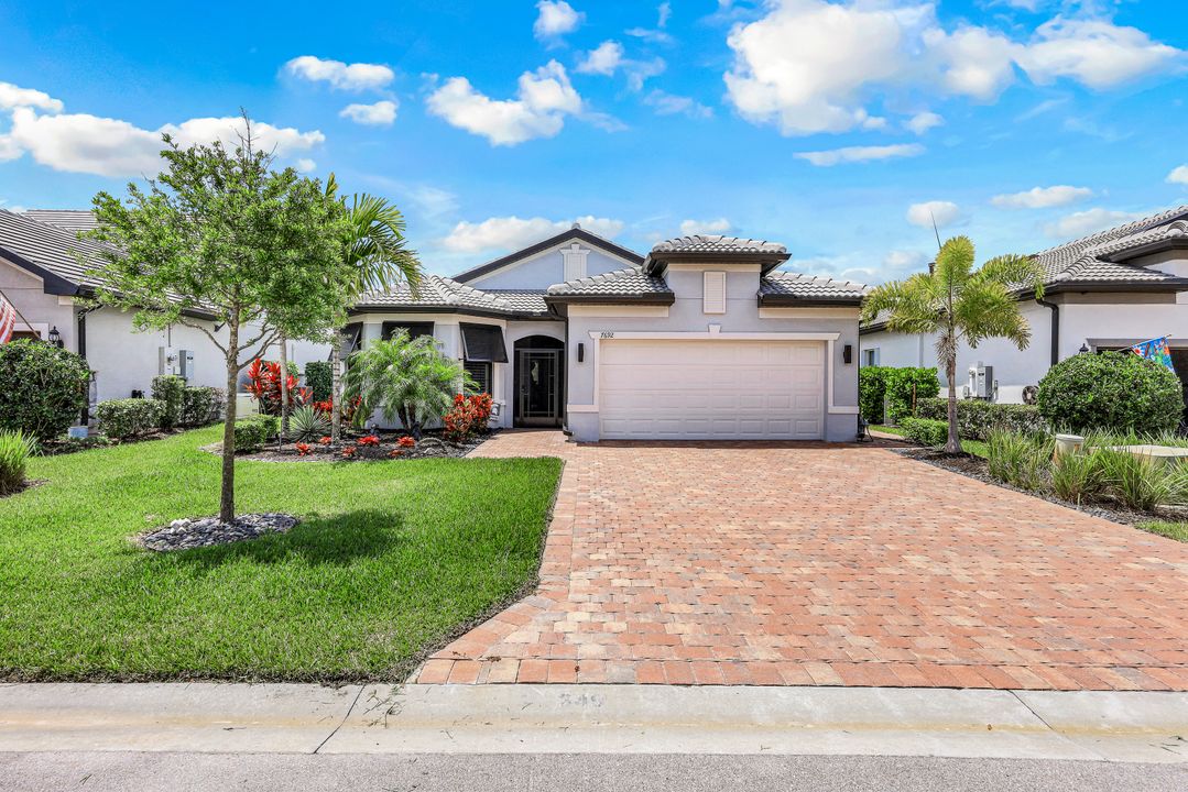 7692 Winding Cypress Dr, Naples, FL 34114