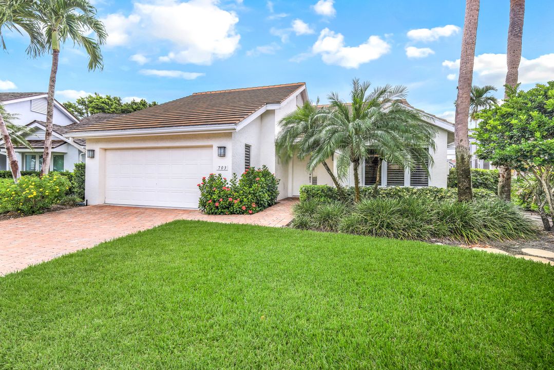 703 Heathery Ln, Naples, FL 34108