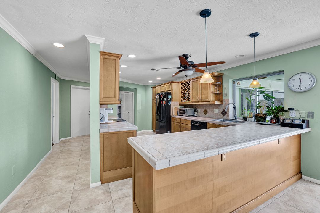 208 Baltusrol Dr, Naples, FL 34113