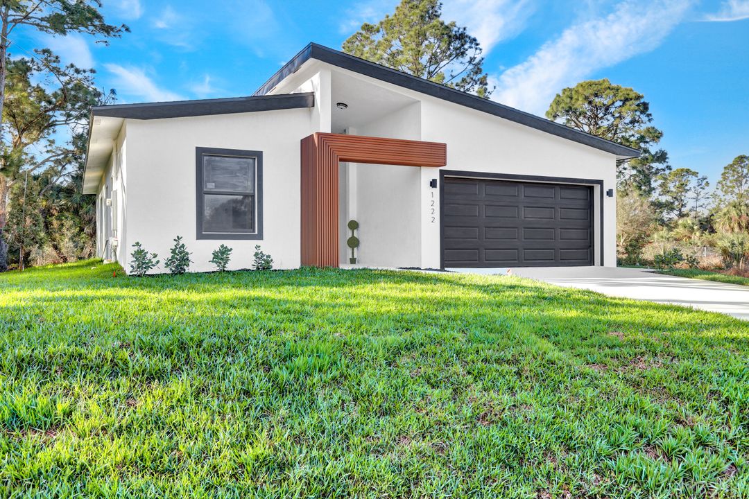 1222 Hilliard St E, Lehigh Acres, FL 33974