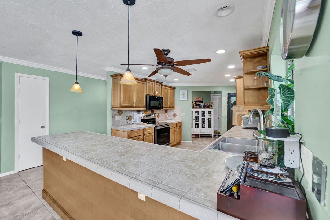 208 Baltusrol Dr, Naples, FL 34113