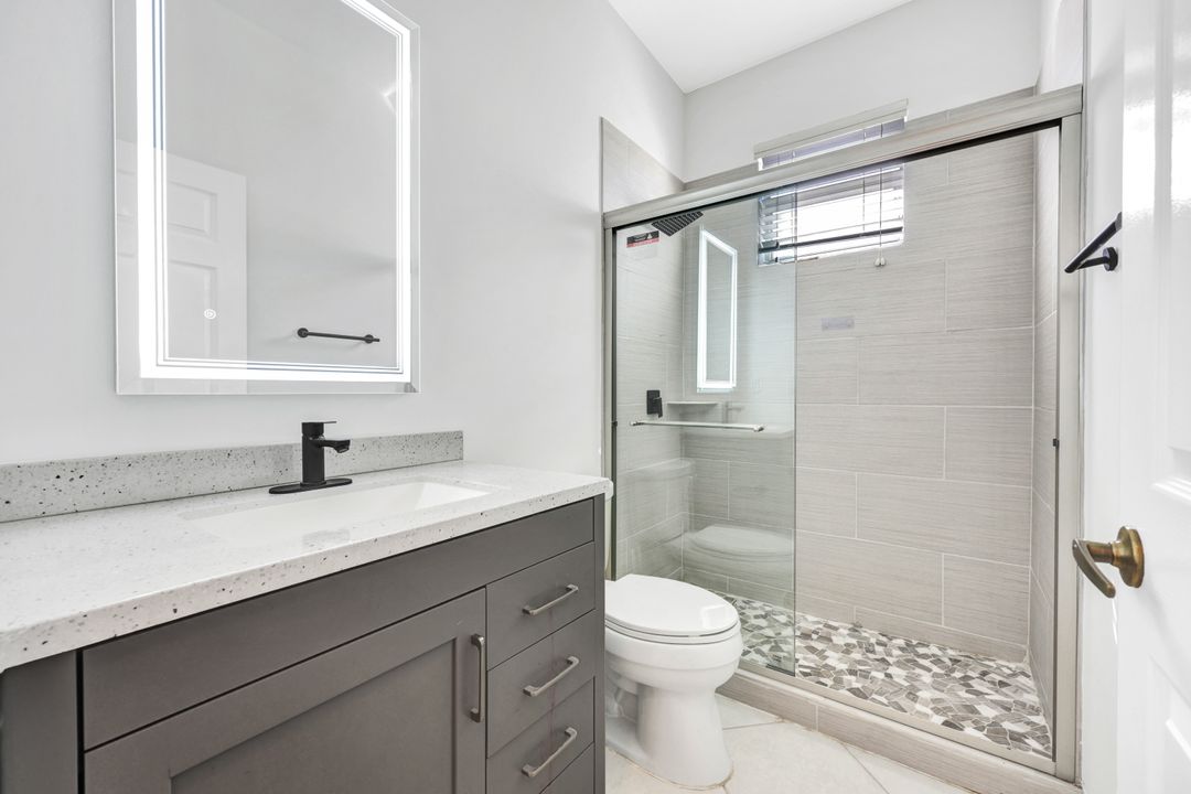 7488 Berkshire Pines Dr, Naples, FL 34104