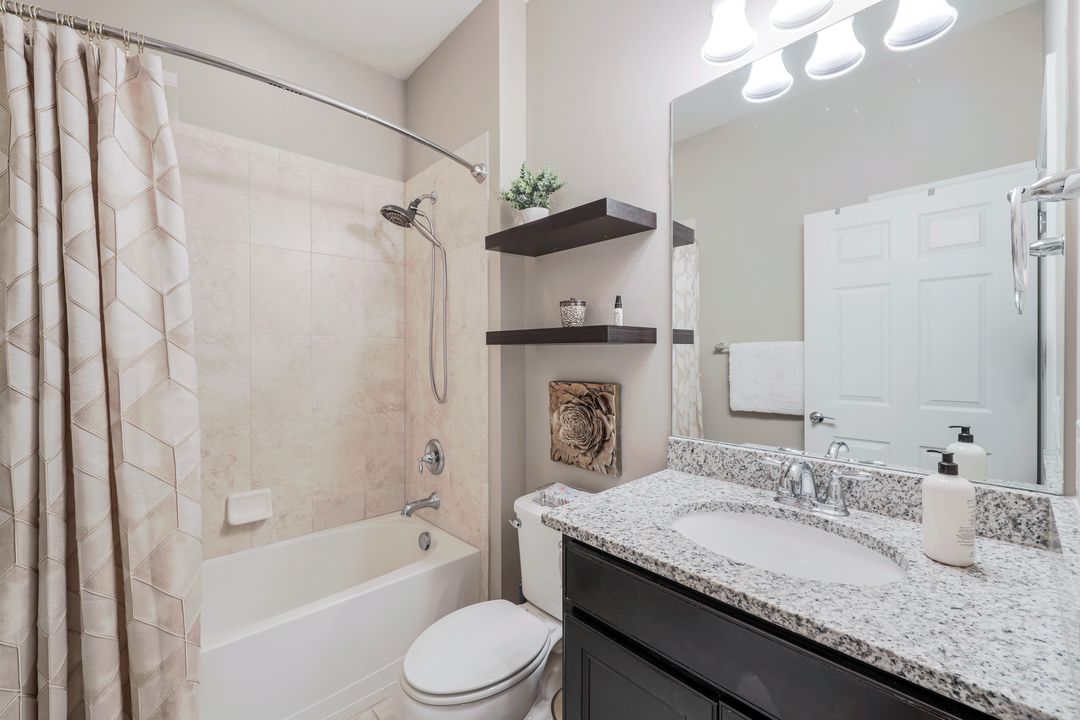 7408 Winding Cypress Dr, Naples, FL 34114