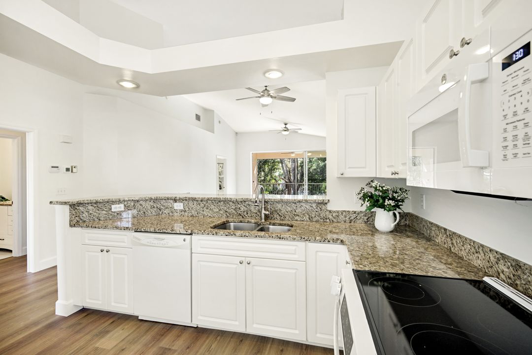 675 Wiggins Lake Dr #202, Naples, FL 34110