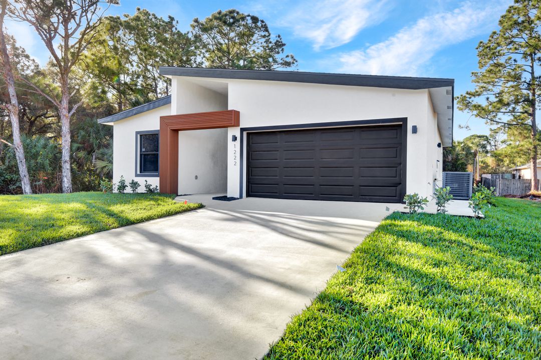 1222 Hilliard St E, Lehigh Acres, FL 33974