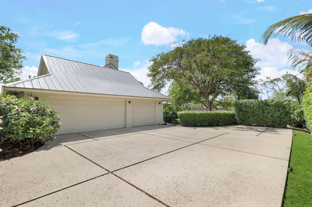 12975 Bald Cypress Ln, Naples, FL 34119