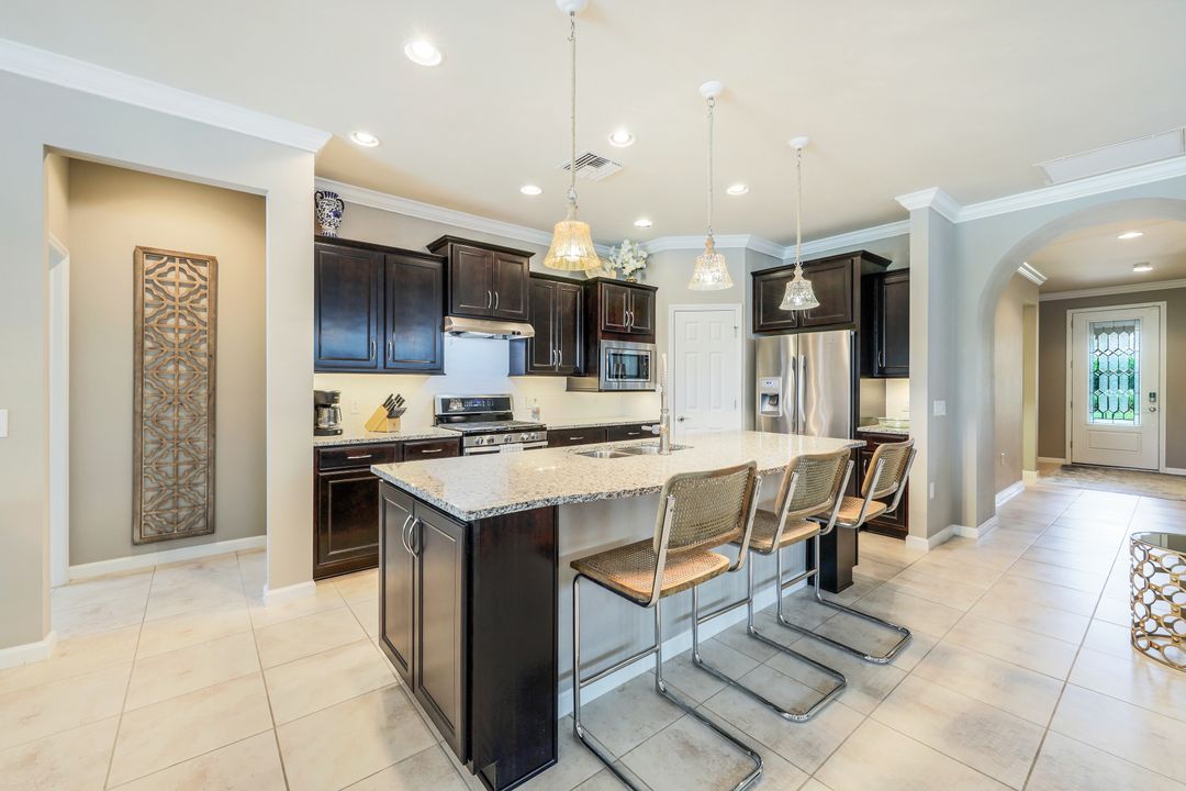 7408 Winding Cypress Dr, Naples, FL 34114