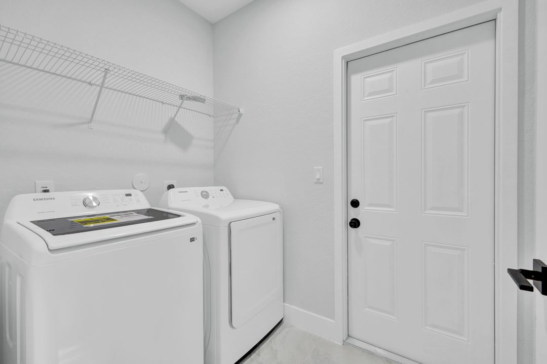 1222 Hilliard St E, Lehigh Acres, FL 33974