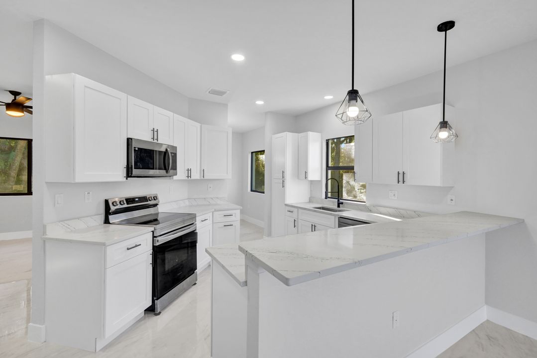 1222 Hilliard St E, Lehigh Acres, FL 33974