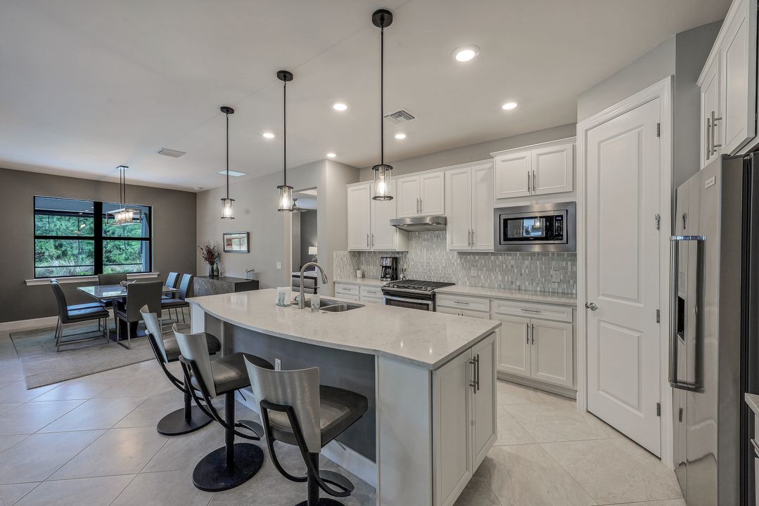 7692 Winding Cypress Dr, Naples, FL 34114